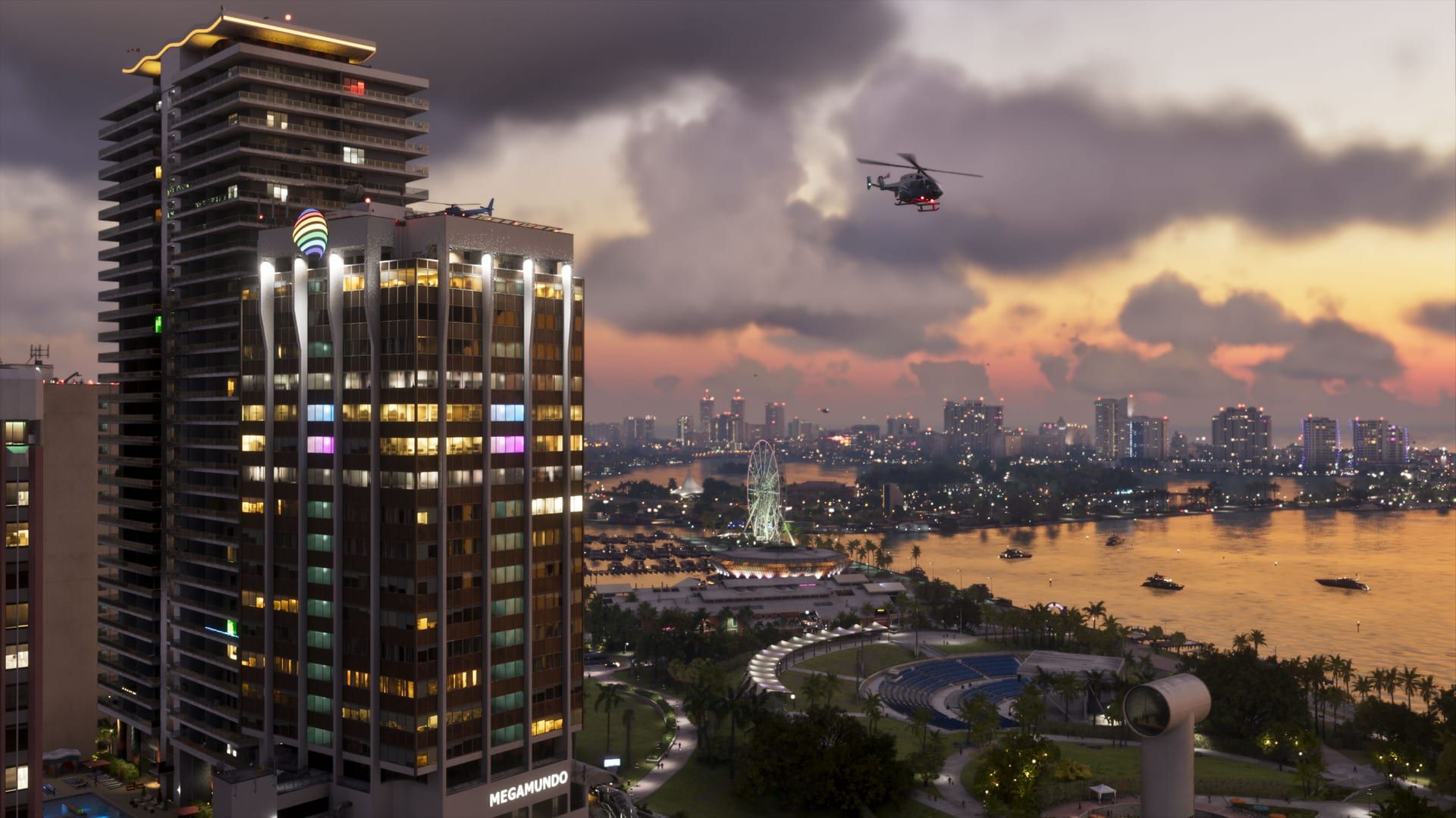 Une tour de Vice City au crépuscule, survolée par un hélicoptère